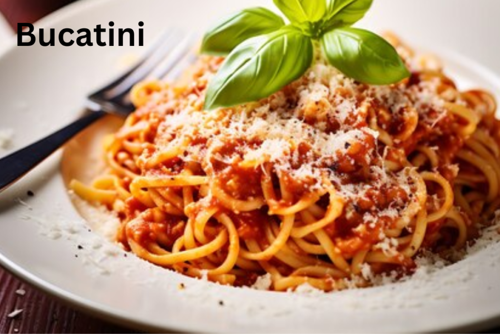 Alt Text: Alt text :Delicious Bucatini pasta topped with a rich tomato sauce, garnished with fresh basil and grated Parmesan, served in a cozy dining setting